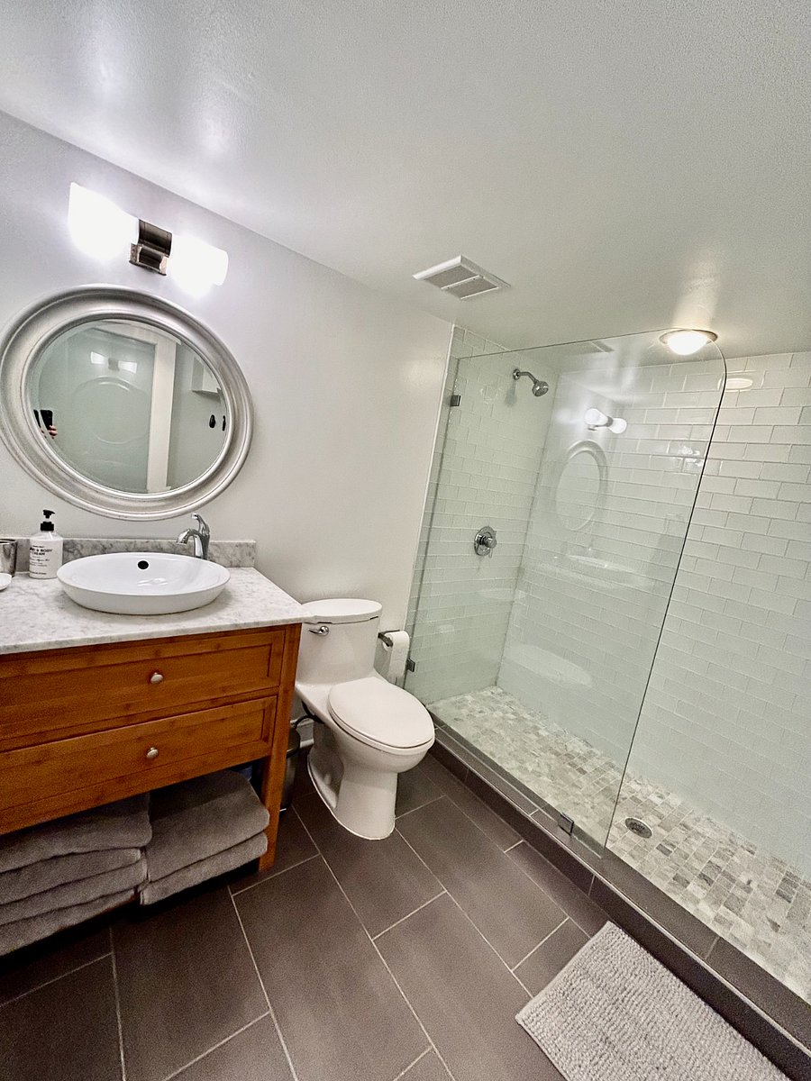Full bathroom with walk-in shower.