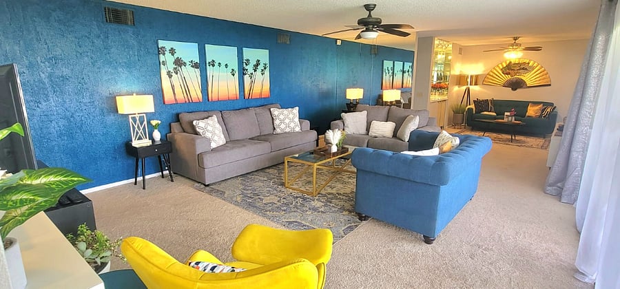 Living room facing wet bar and den