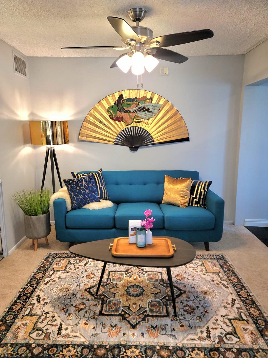 Den pull-out sofa; next to wet bar and weight room