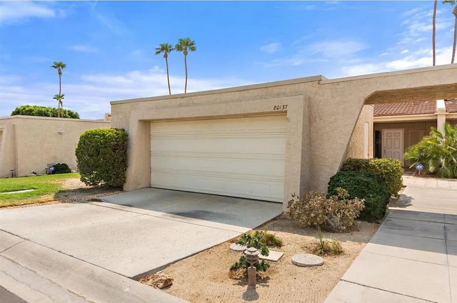 Garage and entrance to townhome