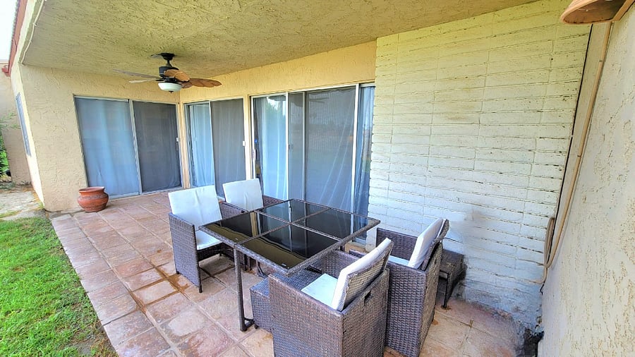 Golf course side patio; enters into living room and dining room