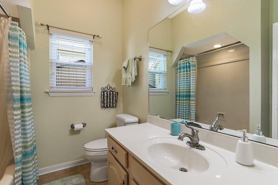 This hall full bath is located just outside the second and third bedrooms.