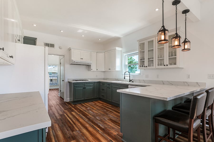 Remodeled kitchen with plenty of cabinet space and quartz countertop.