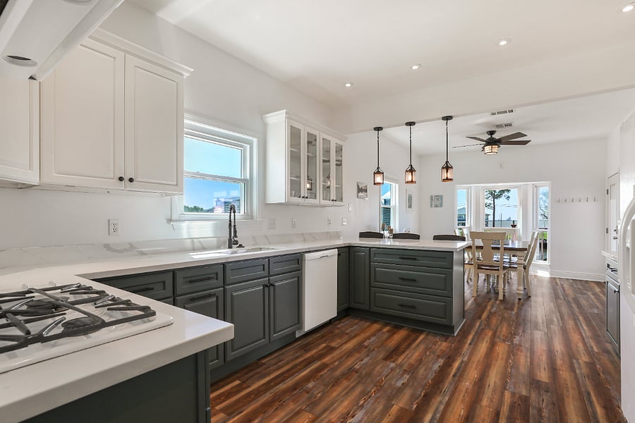 Kitchen as seen from the laundry room looking toward the dining area with view of the waterway.