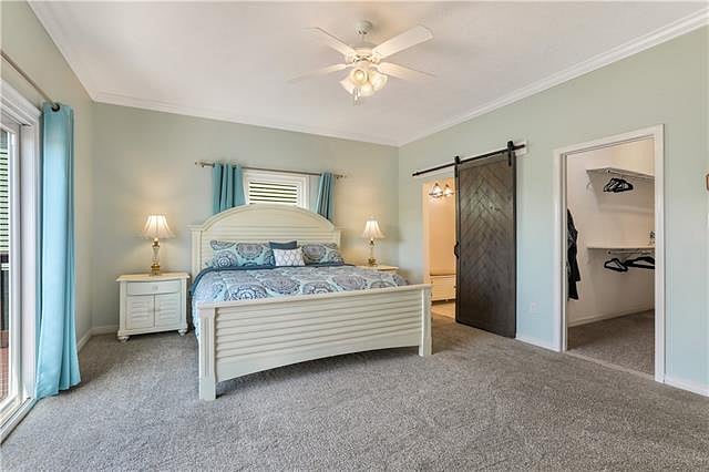Another view of the primary bedroom from a slightly different angle.