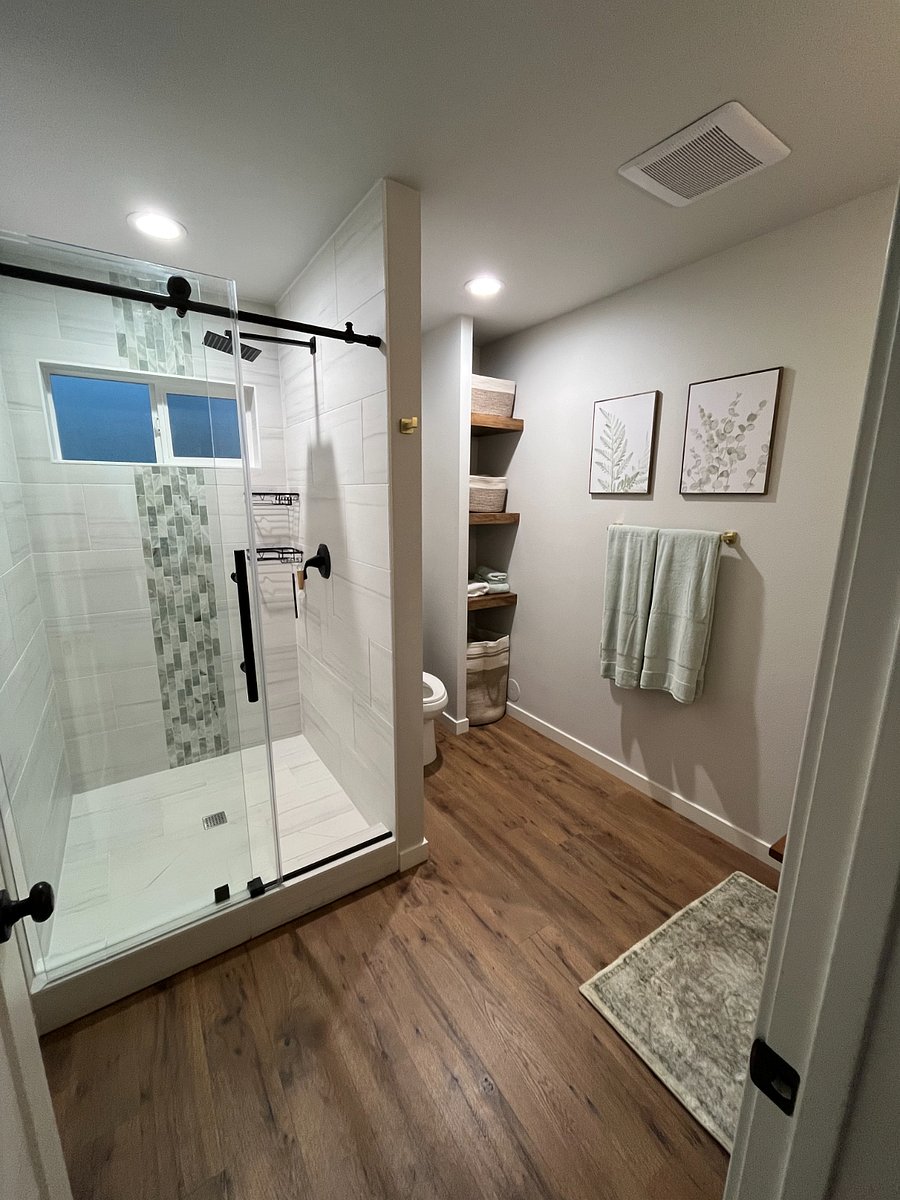 Over-sized shower, storage shelves