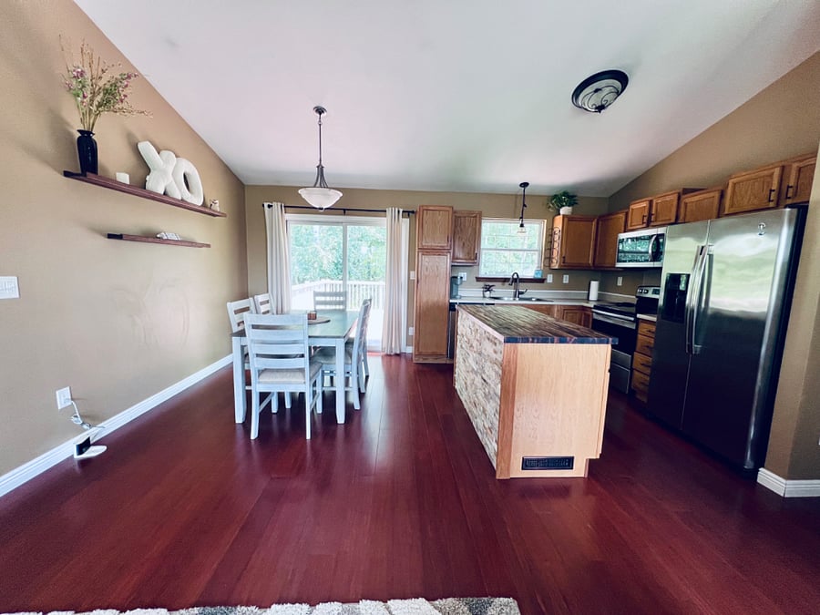 Brand New beautifully distressed dining set. Enjoy the large open space with vaulted ceilings.