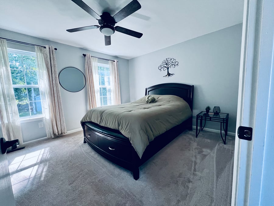 Queen bed (drawer storage) with 2 night stands and a 50 inch New Smart TV.