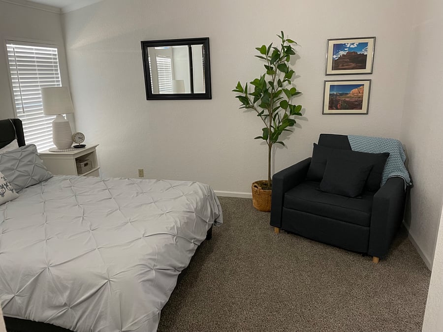 Primary bedroom with seating area