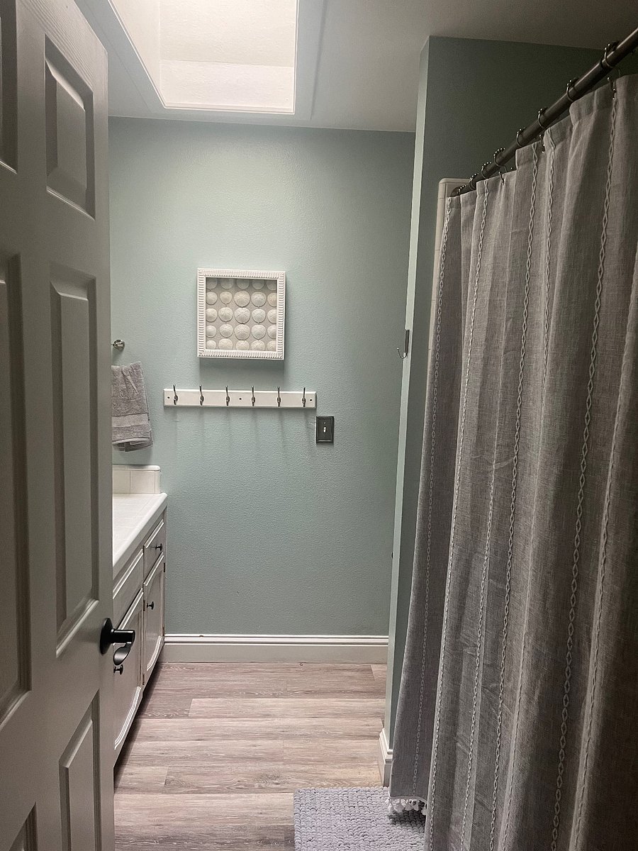 Second bathroom, tub shower and two sinks