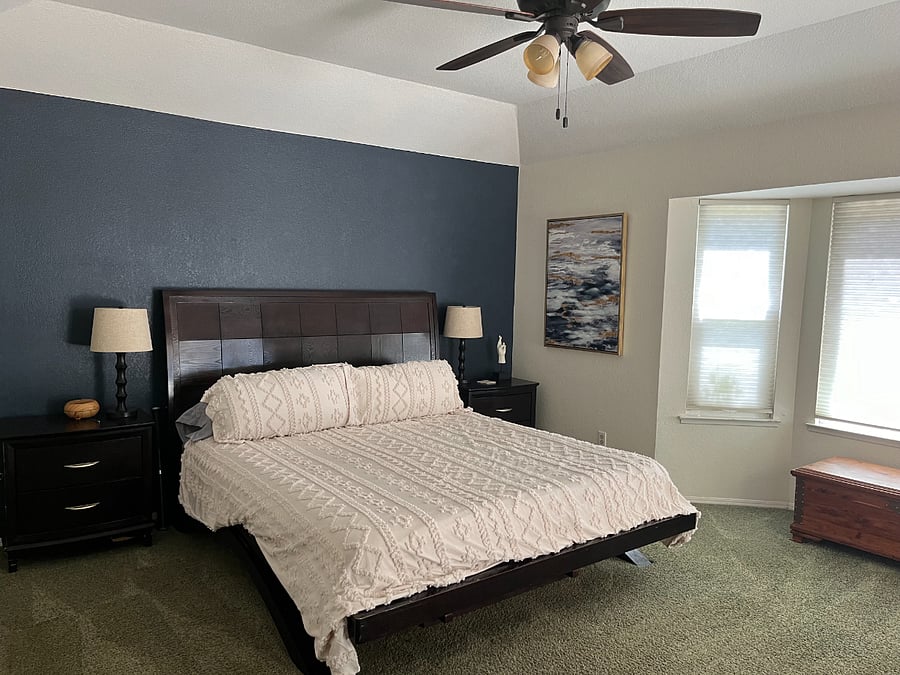 Master Bedroom, California King bed, large walk in closet with built in shelves and dresser in room