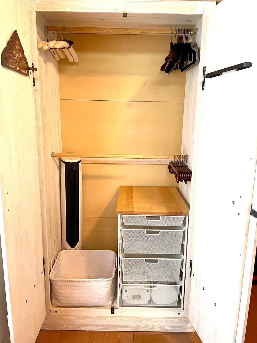 Armoir interior with Elfa drawer storage.