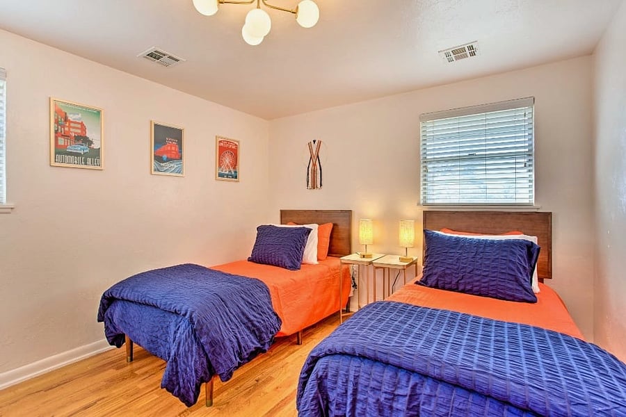 Discover versatility in Whitewood Farm's third bedroom, where two twin beds can be combined into one king bed. This room also features a large closet, making it perfect for any guest arrangement.