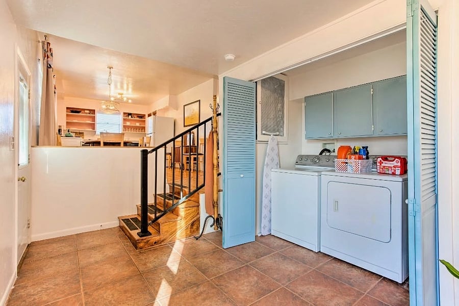 The laundry room includes full size washer and dryer, full size ironing board, and iron as well as starters of laundry detergent and dryer sheets.  The first aid kit and flashlight are also located in this area.