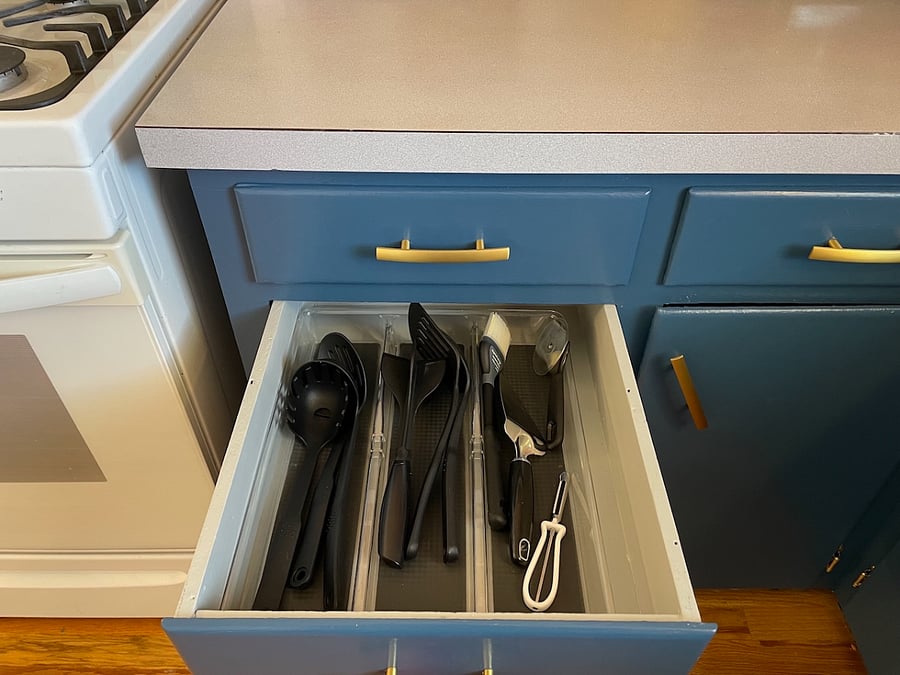 In the lower cabinet section of the south side of the kitchen you'll find an array of cooking and serving utensils, designed to make cooking and serving food a breeze.
