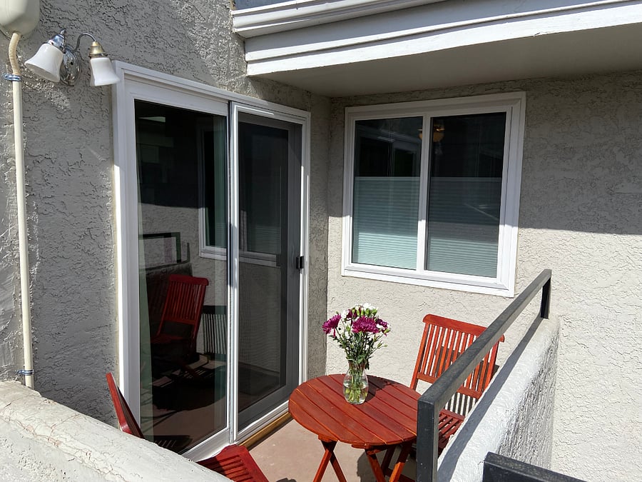 Sunny private balcony with table and chairs. Enjoy direct winter sunlight to warm the condo and indirect summer light to avoid the heat.