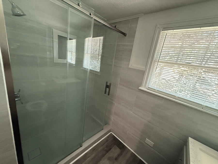 This newly remodeled bathroom maximizes both comfort and function. While compact, the space feels fresh, clean, and updated with modern finishes throughout. It features a large walk-in shower with no tub, offering a sleek, spa-like experience thats both practical and easy to maintain. Bright, refreshed, and well-appointed, this bathroom provides a comfortable and efficient space to start and end your day.