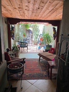 Looking from entry door out into private courtyard- front of home