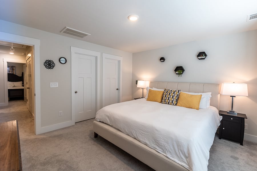 The primary bedroom has a walk-in closet, bathroom, and TV.