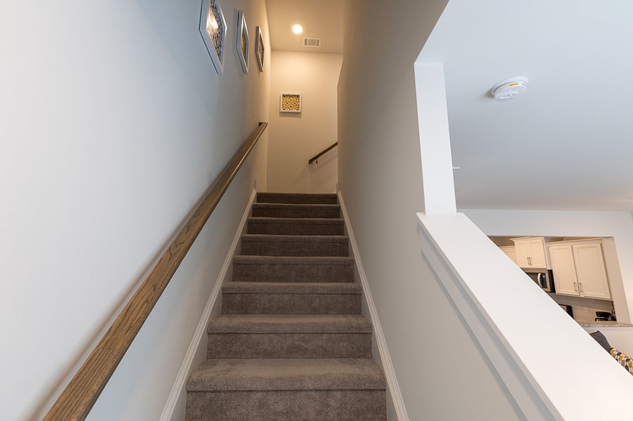 Stairs leading up to the bedrooms and washer/dryer.