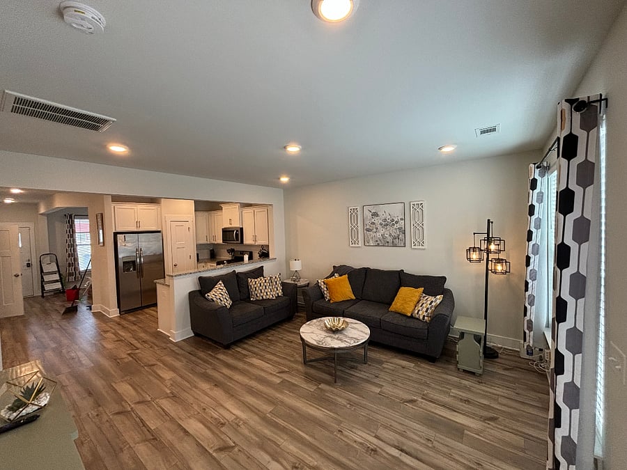 The kitchen, dinette, and living room complete the open concept living area making it easy for conversation.