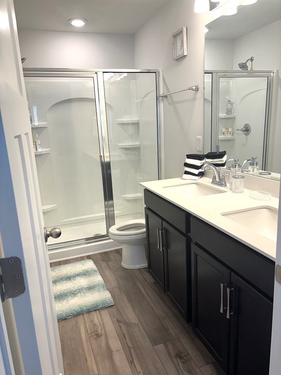 The primary bathroom has a shower and two sinks.  Towels and washcloths are provided.