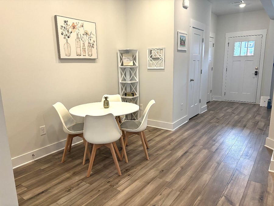 Small dinette table just off the kitchen, convenient for a quick meal.