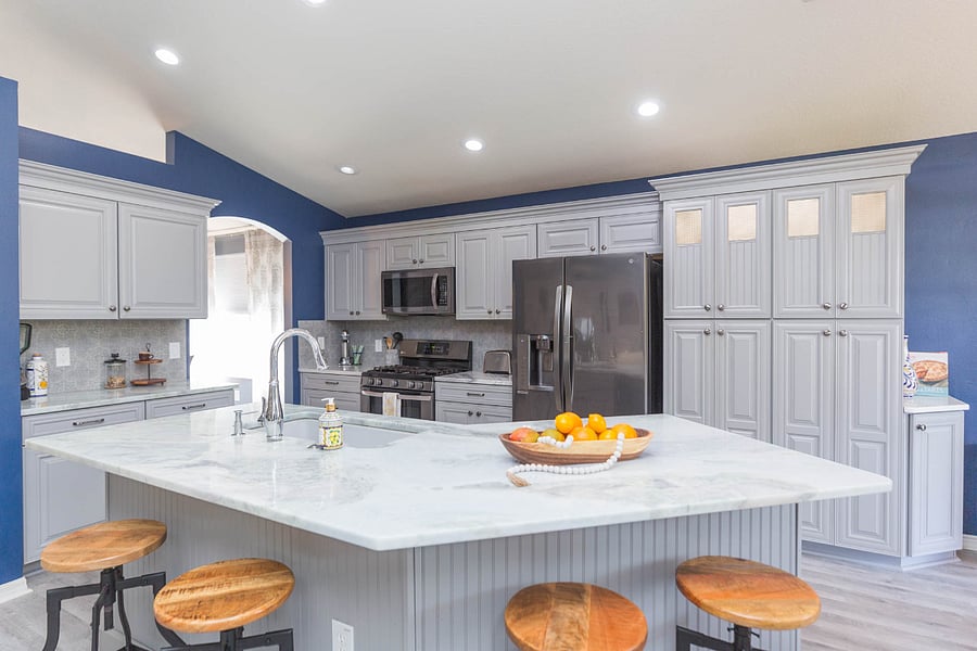 Kitchen island with height adjustable bar stools.