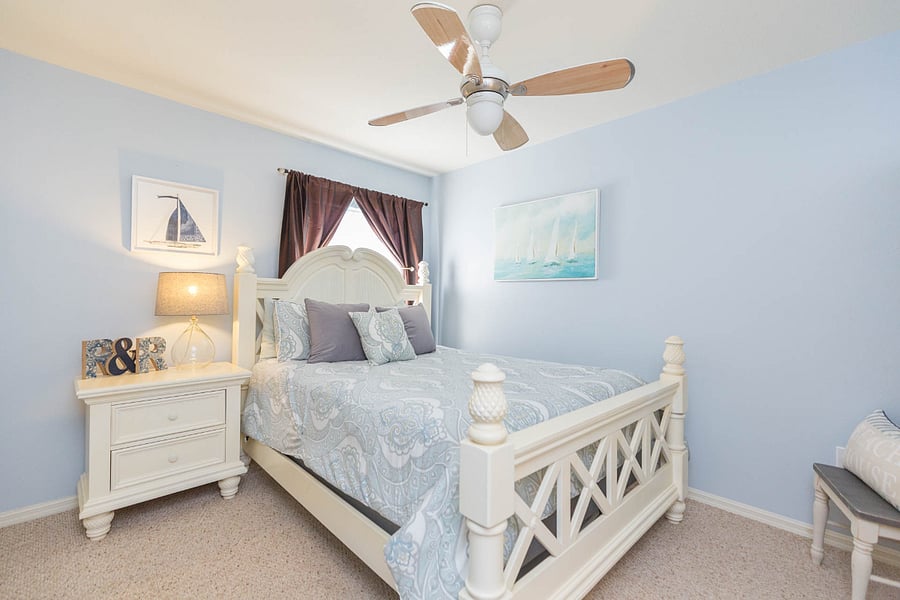 Bedroom 2 is Queen sized with armoire, nightstand and full-sized closet. Small tv for Roku/DVD or game console viewing.