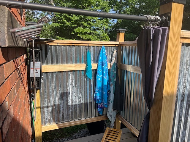 Back yard Outdoor Shower runs on propane tank.