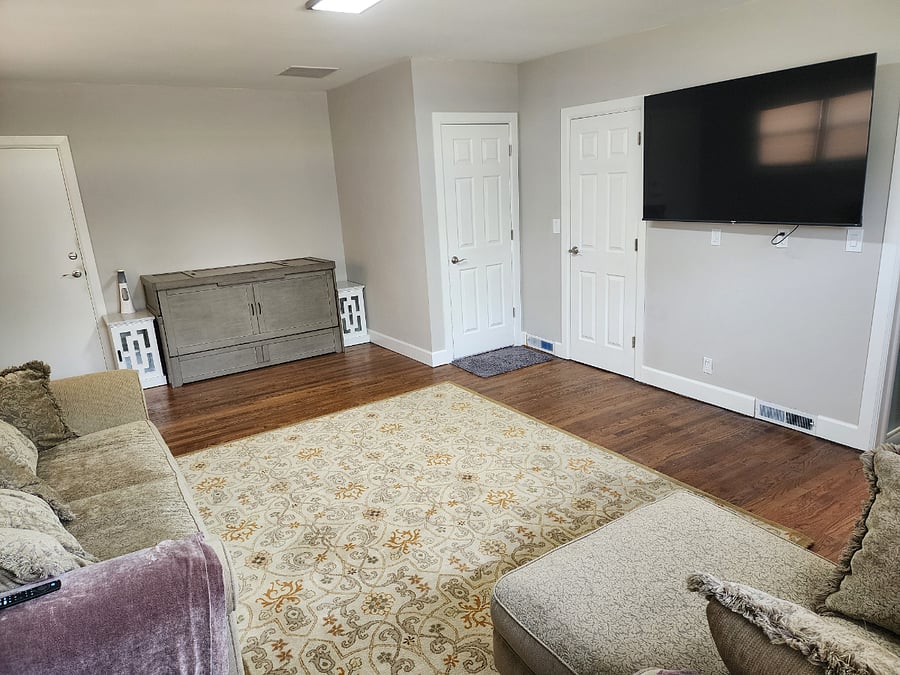 Grey looking cabinet is a queen Murphy Bed