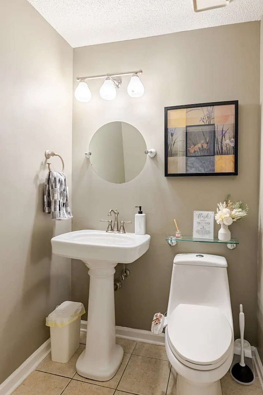 The convenient half bathroom is accessible from the living area on the main floor.