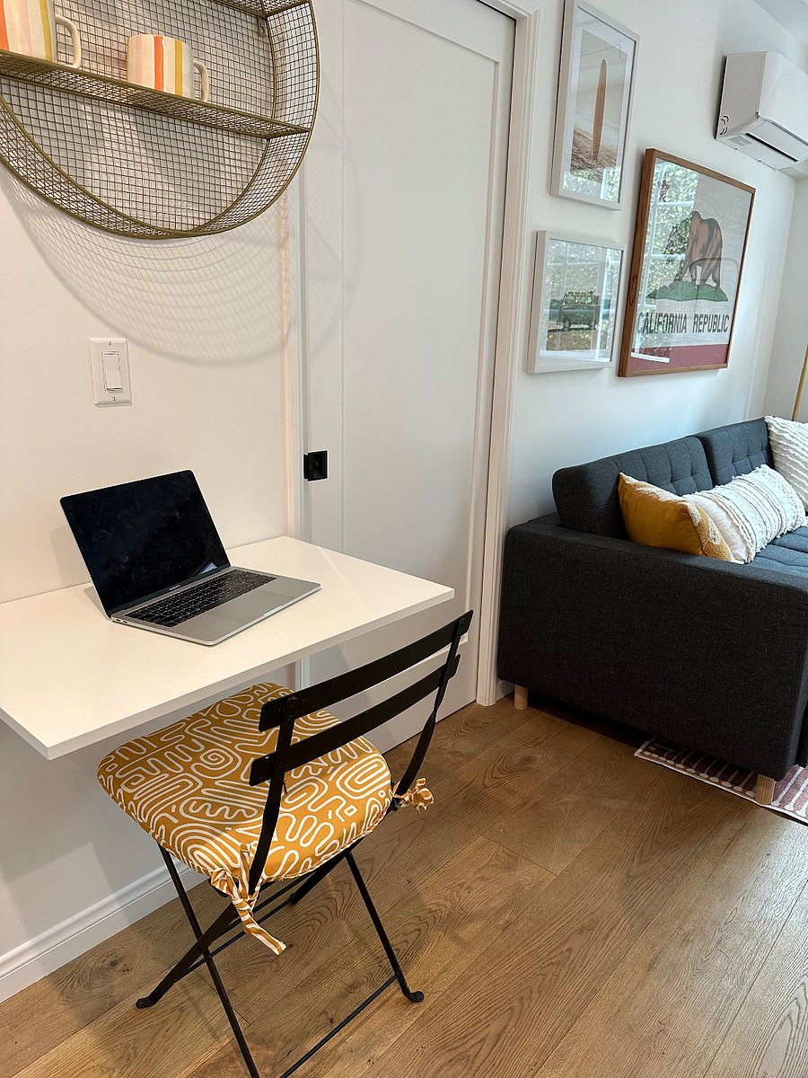 Laptop desk folds down when loading washer/dryer or can be used as a laundry folding station if needed.