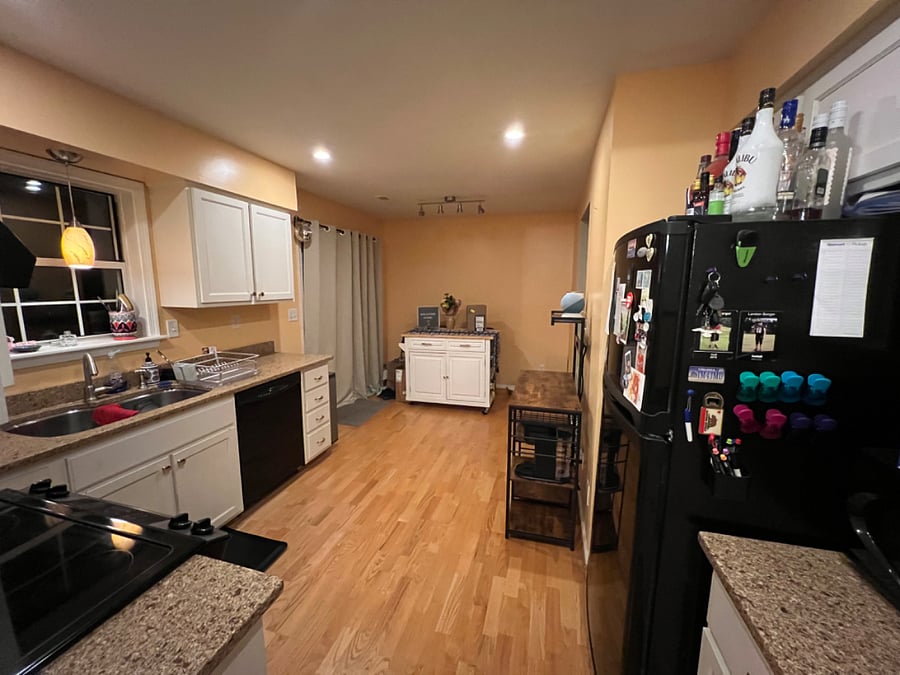 Kitchen. The door on the left leads to the fenced in back yard with a nice porch.