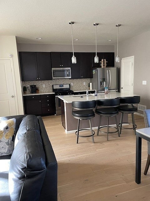 Full kitchen with breakfast bar and 6 chair dining room table