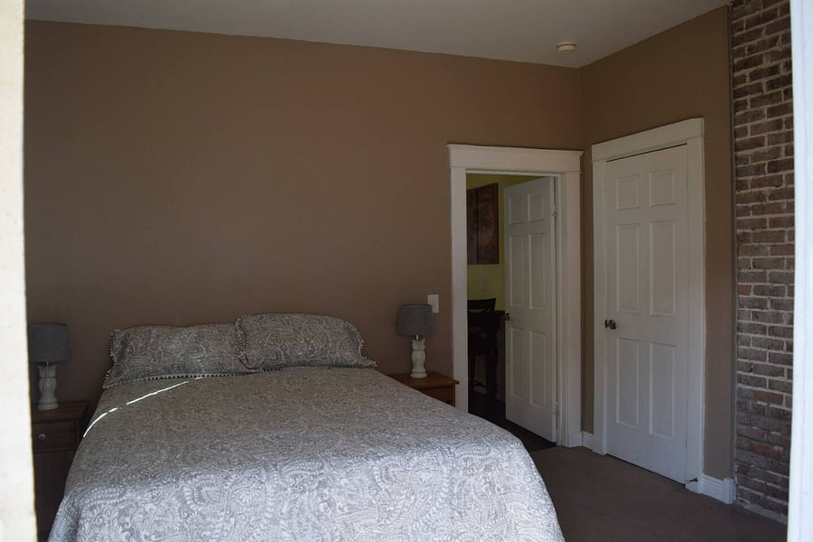 Private bedroom in the back with it's own exterior entrance through the fenced in back yard locked gate.
