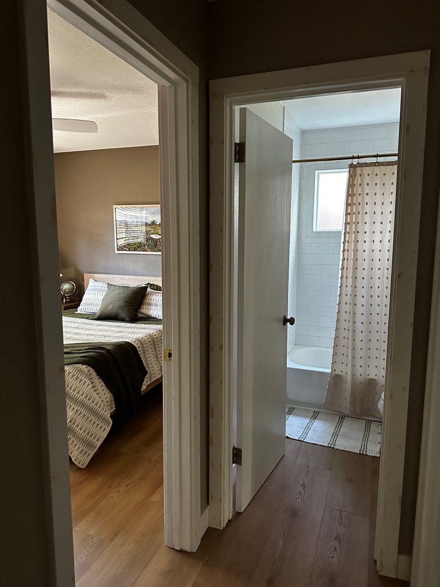 Bedroom and bathroom from hallway view