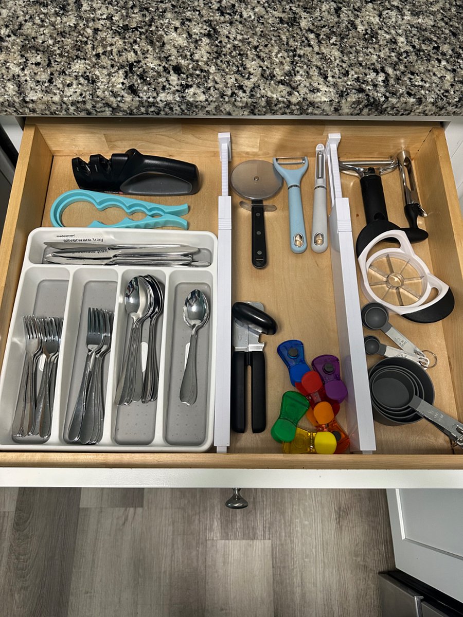 Silverware place settings for 8; vegetable peelers; can opener; apple slicer, corer.