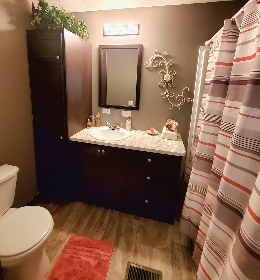 Bathroom in room with king size bed.
$800/month