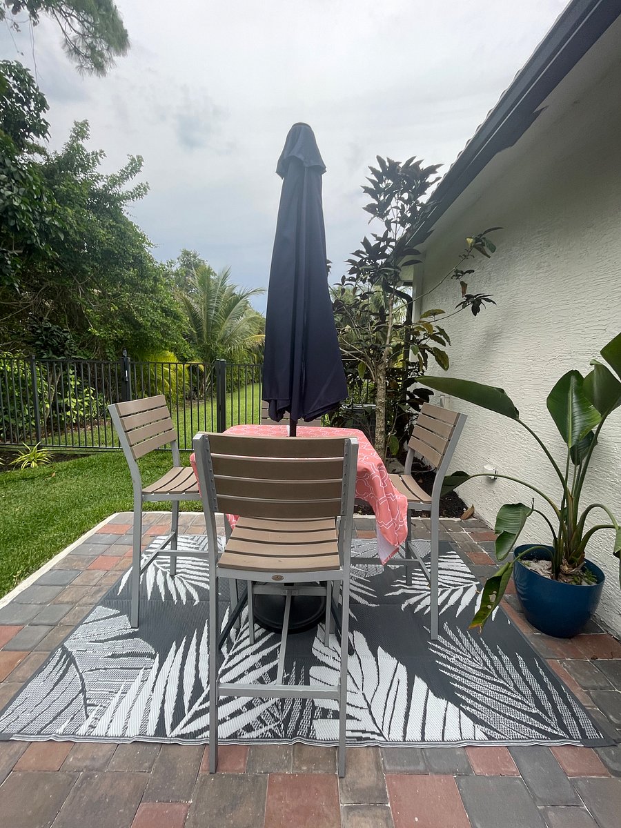 Dining area with large patio umbrella