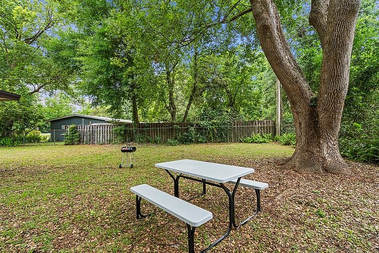 Grill and picnic table in backyard