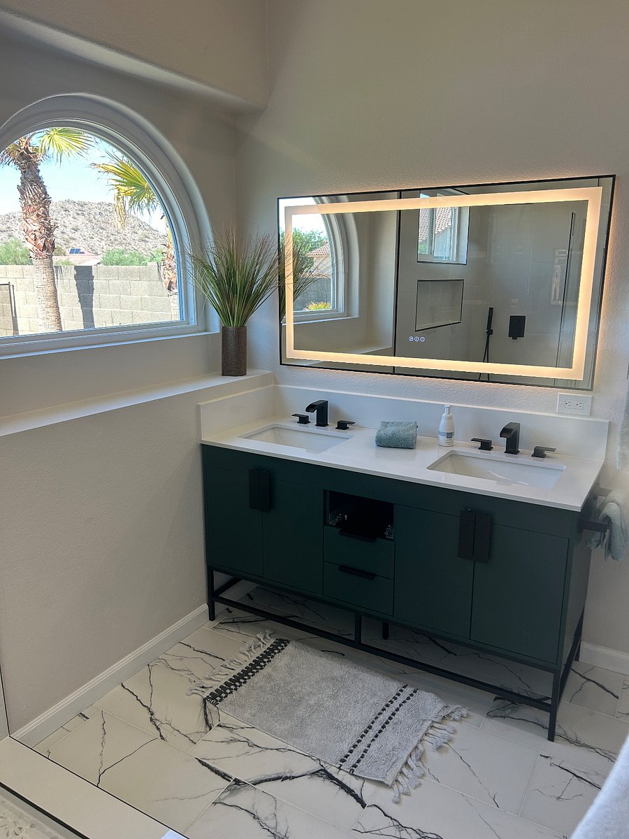 Primary bath - dual sinks - lighted mirror & view to backyard