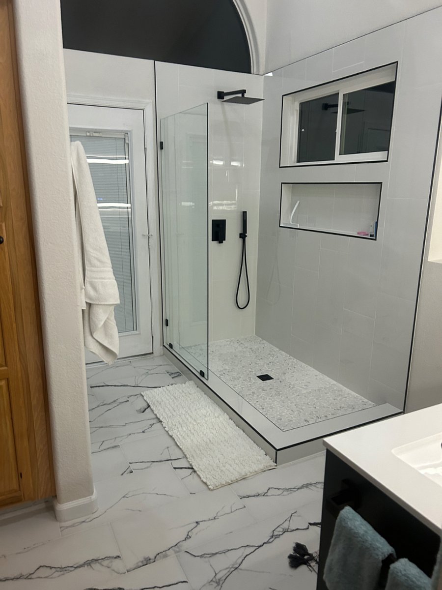 Walk-in shower with rainfall shower & hand sprayer & access to backyard