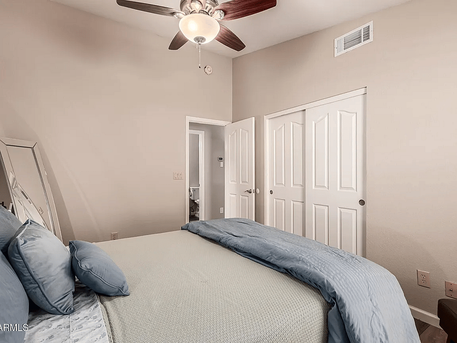 Bedroom with queen-sized bed and large closet