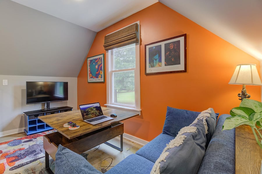 Coffee table converts to laptop station workspace or additional dining spot.