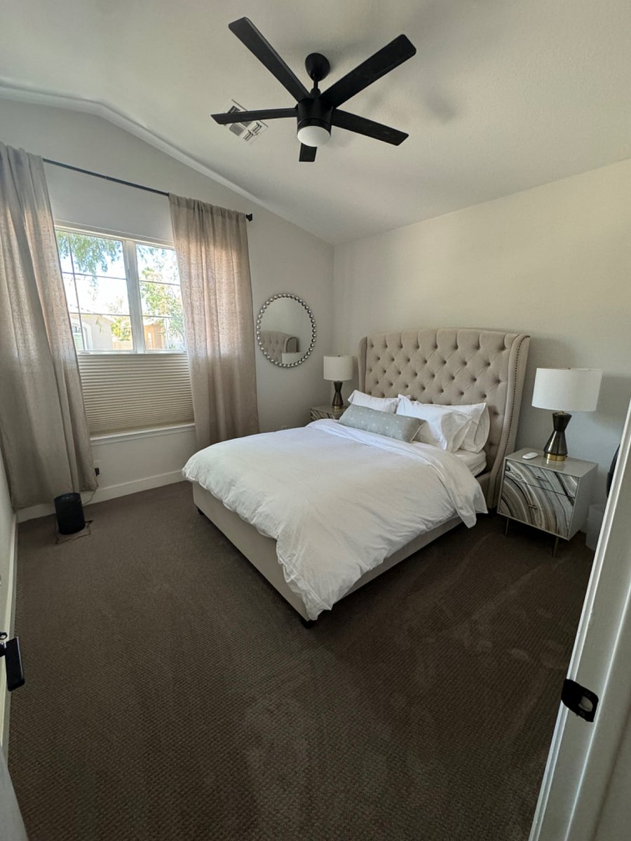 Bedroom for rent w black out shade, down pillows and comforter, and comfortable motion mattress.