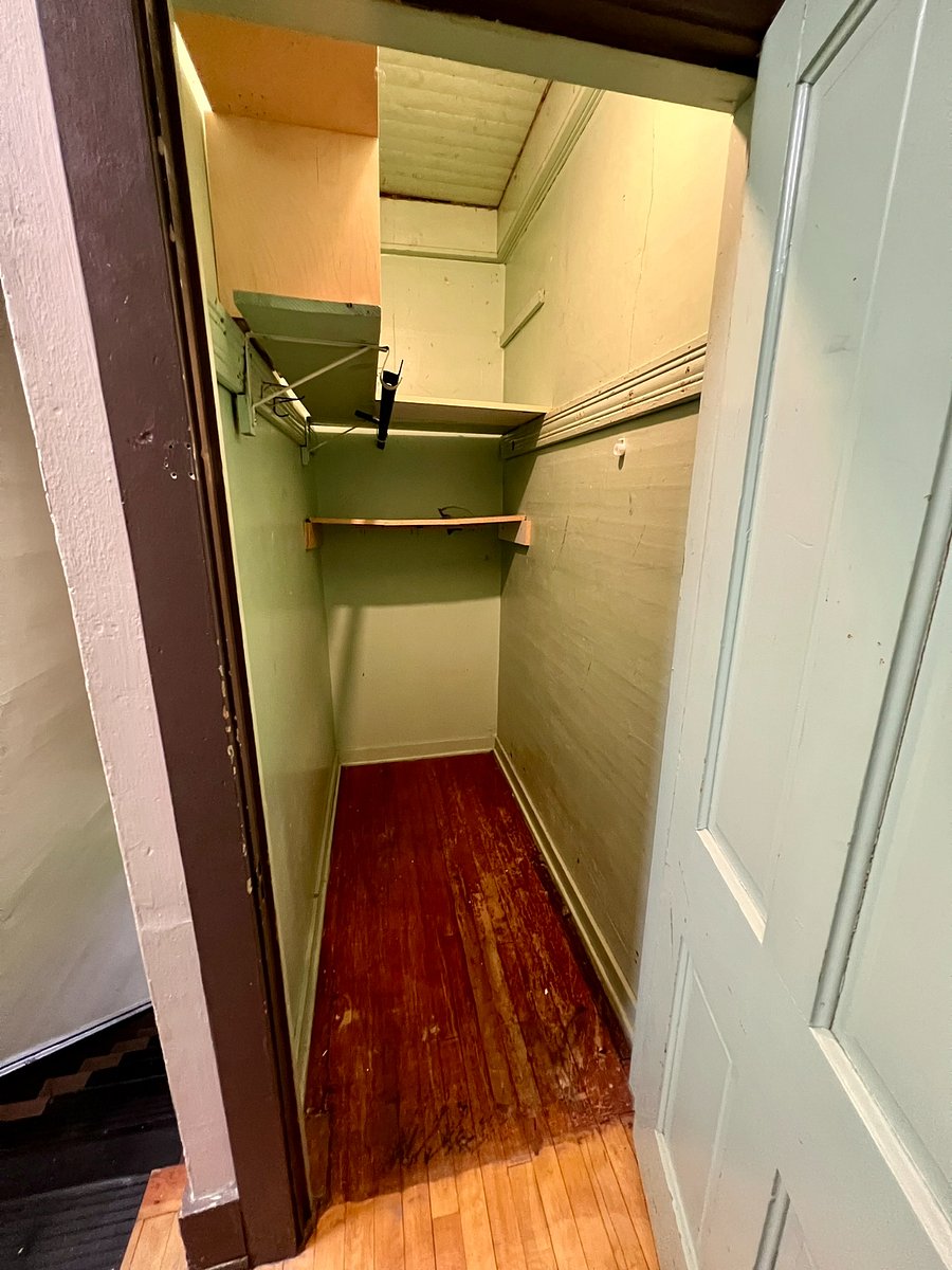 Storage closet at top of stairs by apartment entrance.
