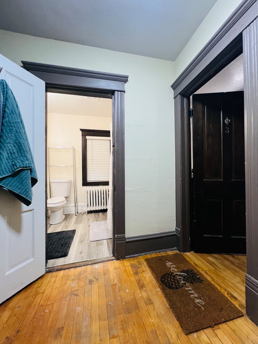 The fully private bathroom for this unit is next to the apartment door.