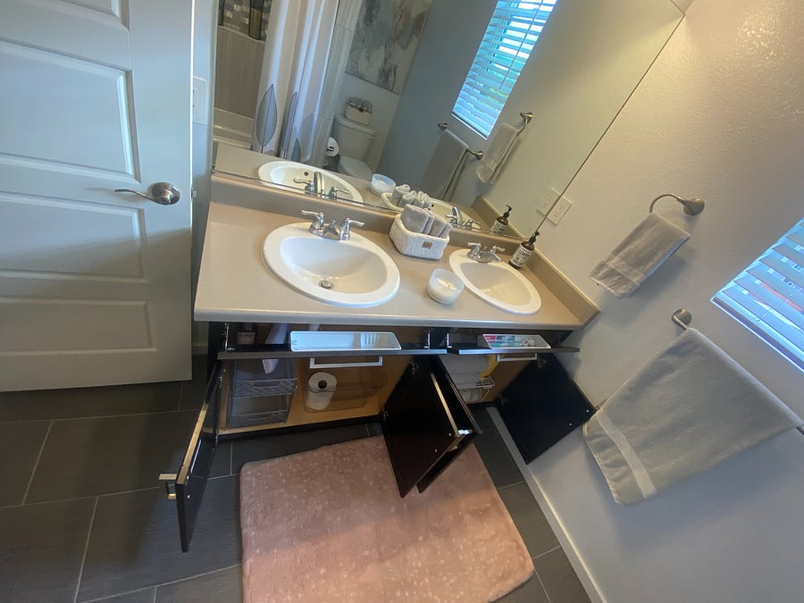 So much storage with hidden drawers that pull down, under the cabinet organizers, spare towels.
