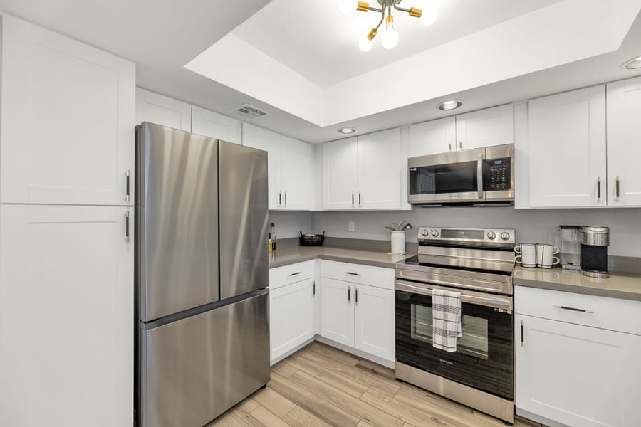 Updated stainless steel appliances. Pantry to the left of refrigerator